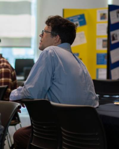 man listening to presentation